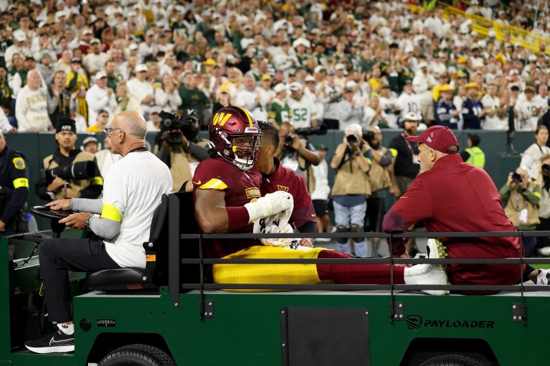 Commanders DE carted off, ruled out of TNF